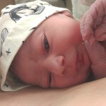 newborn with a hat
